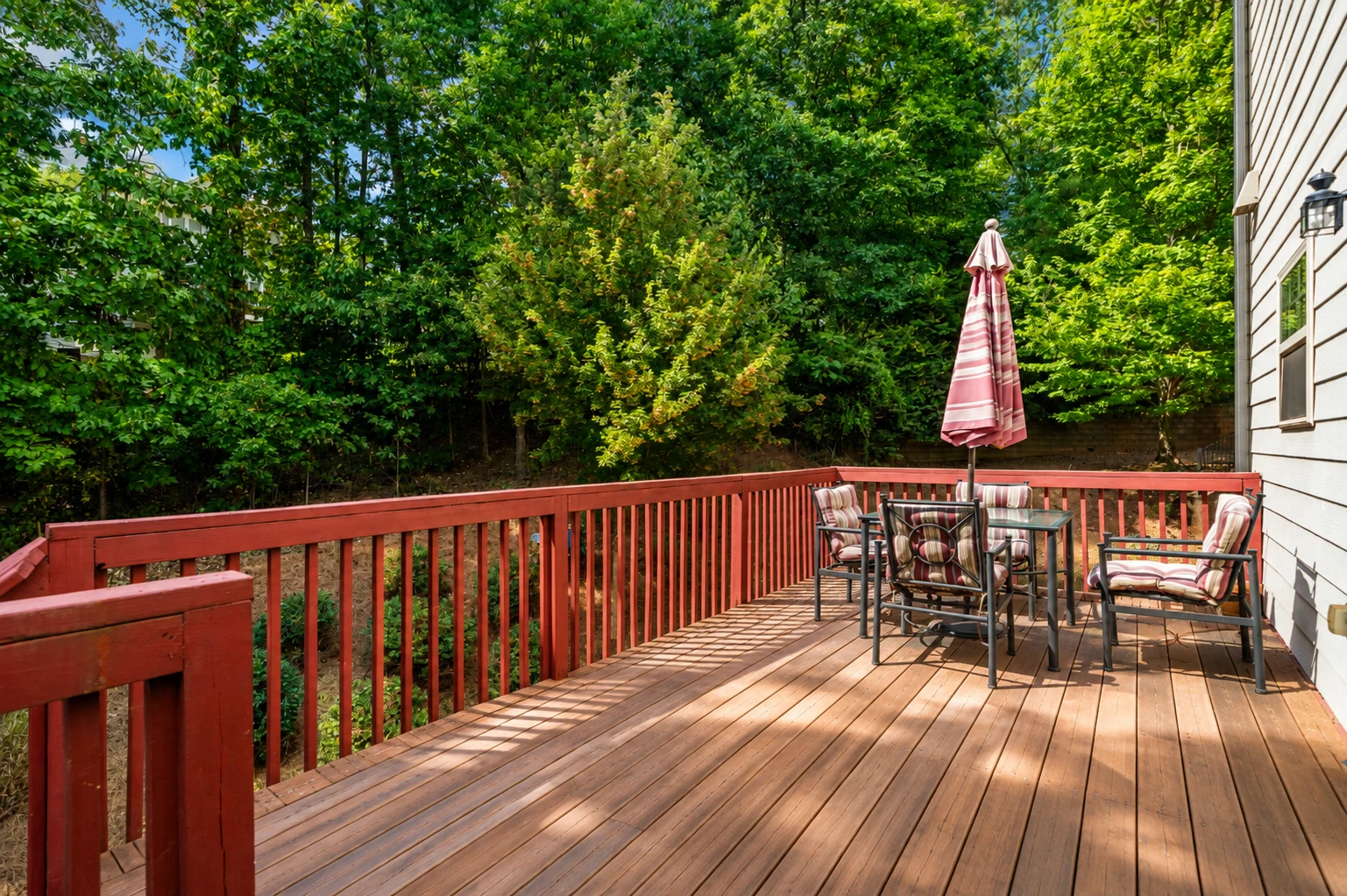 Rear wood deck with trees beyond